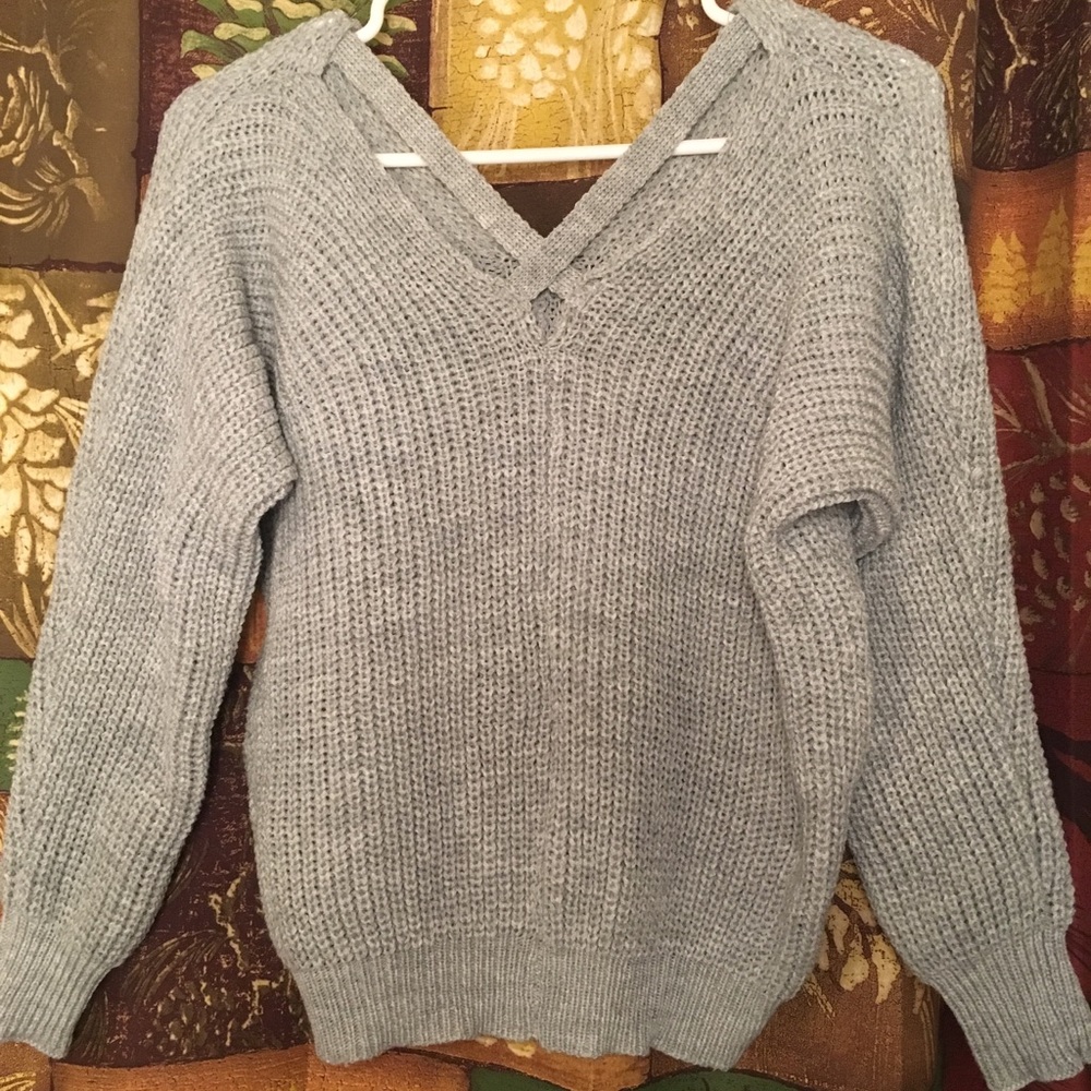 Super cute grey sweater with crisscross back :)